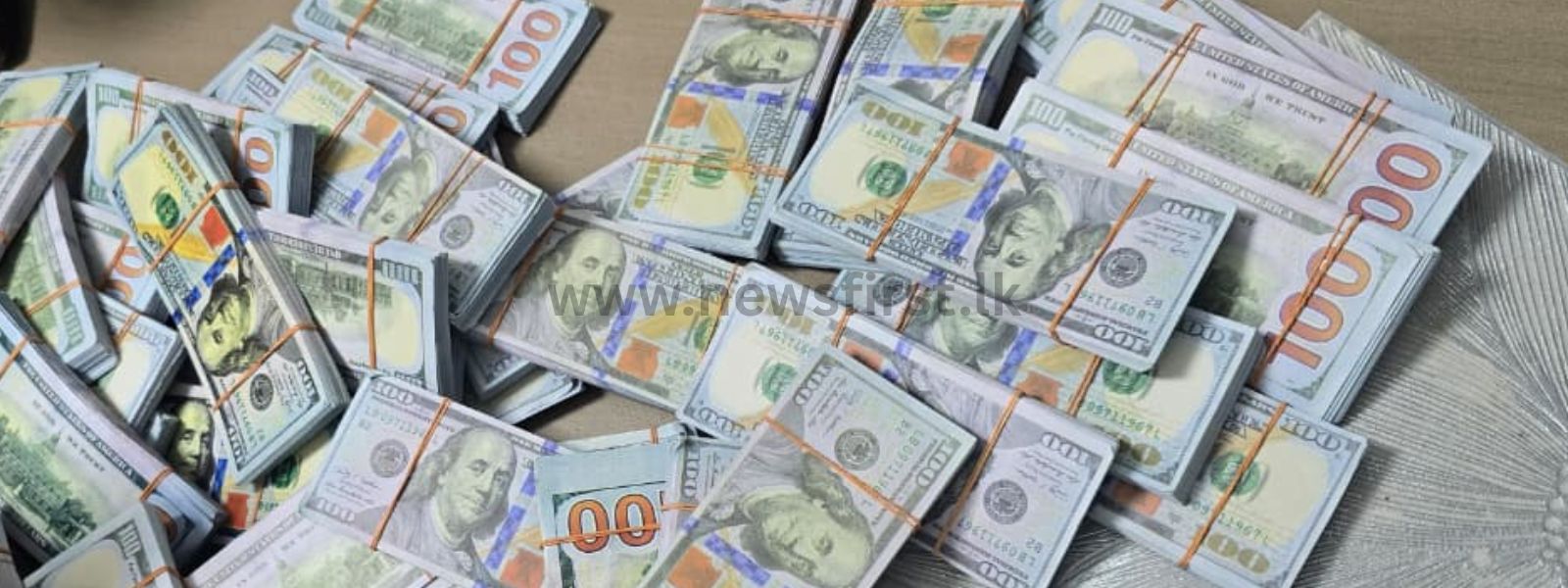 Woman Arrested with Fake Dollars Worth Rs. 190 Mn